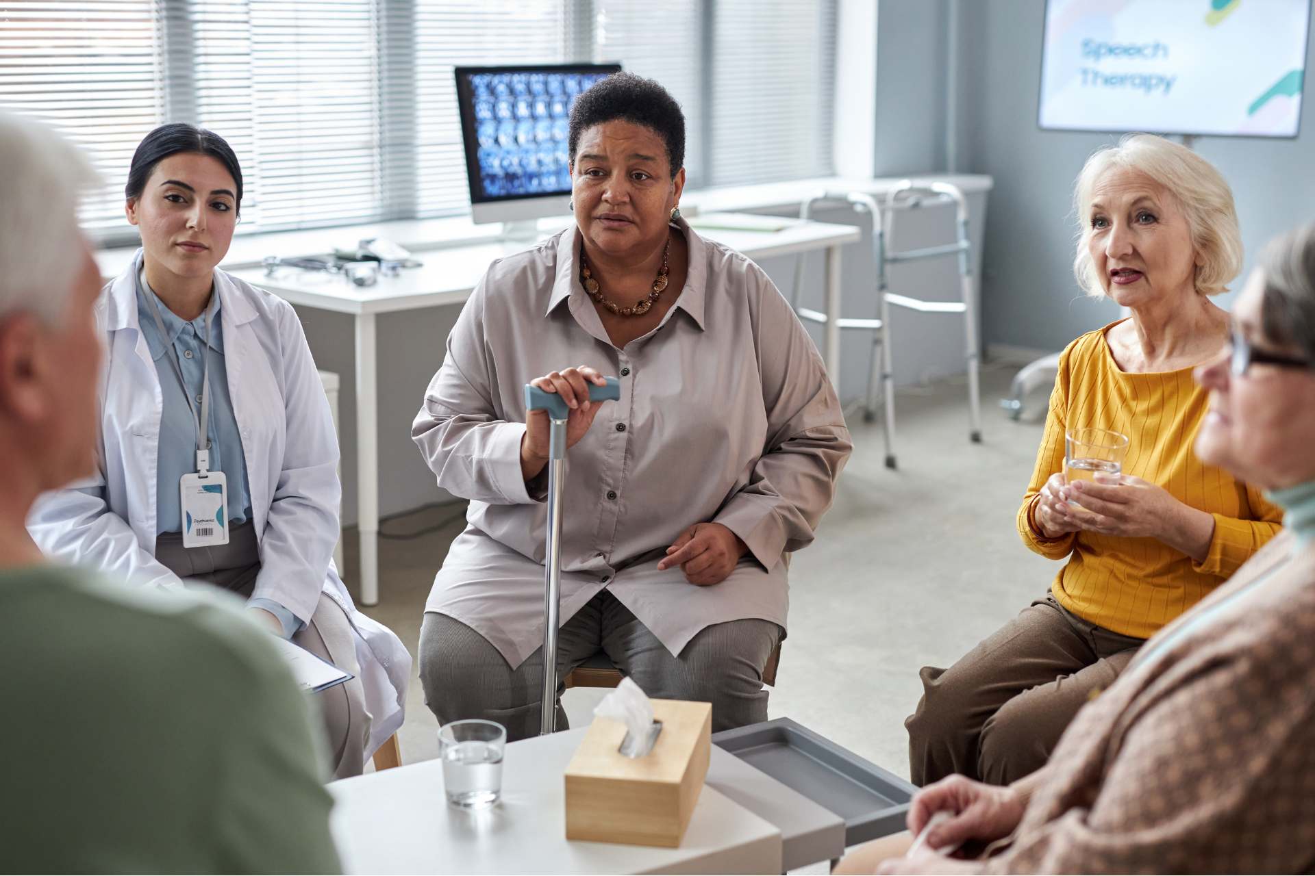 Senior women in a doctor's office talking to their doctors.